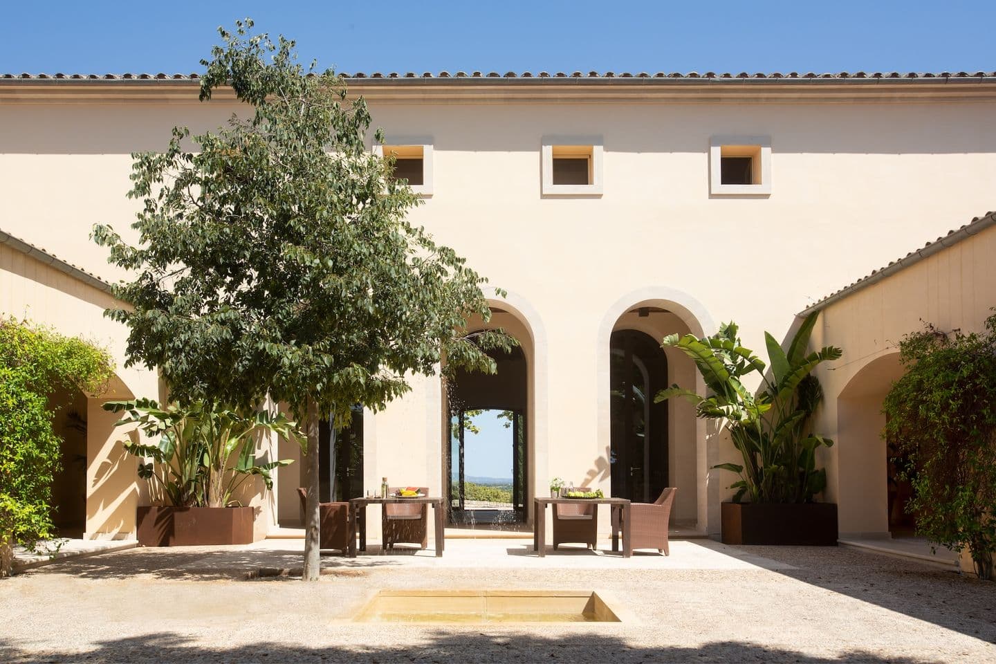 Courtyard of a Mallorcan finca with arches and terrace
