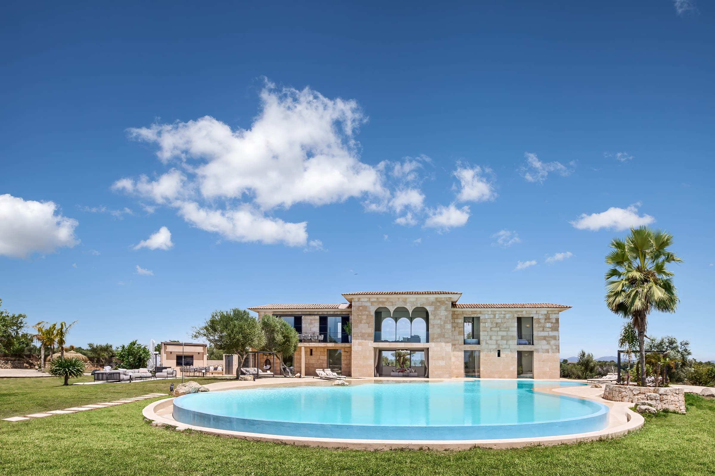 Natural stone country house with a round pool in Mallorca